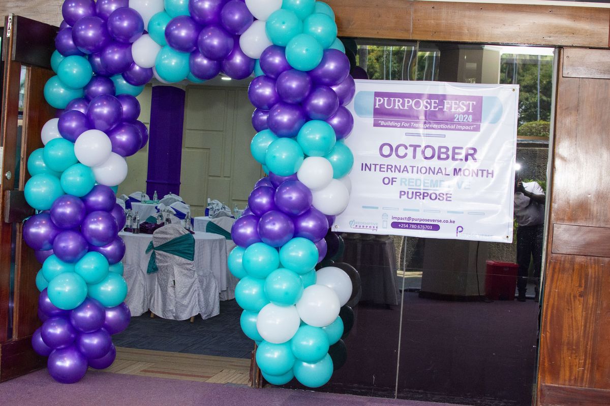 The balloon arch and the October, International Month of Purpose banner at PurposeFest 2024