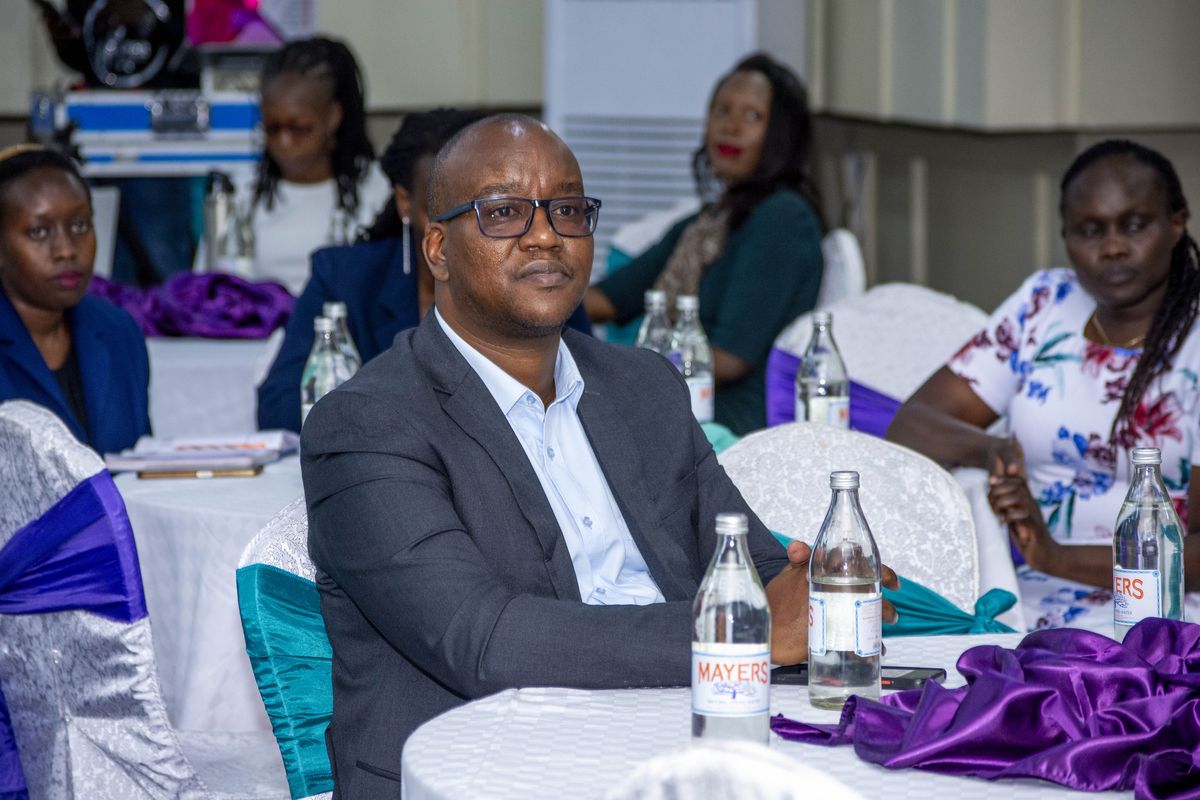 A delegate listening during a plenary session at PurposeFest 2024