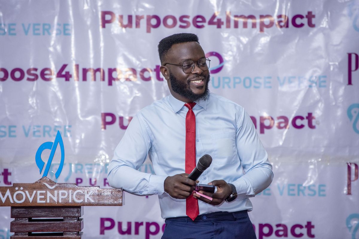 A host opening a session at PurposeFest 2025