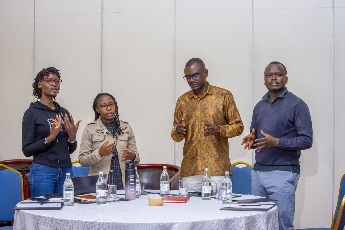 A table group presenting their discussion back to the room at PurposeFest 2025